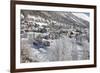 The red train runs across the snowy landscape around Samedan, Maloja, Canton of Graubunden, Engadin-Roberto Moiola-Framed Photographic Print