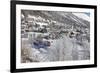 The red train runs across the snowy landscape around Samedan, Maloja, Canton of Graubunden, Engadin-Roberto Moiola-Framed Photographic Print