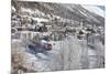 The red train runs across the snowy landscape around Samedan, Maloja, Canton of Graubunden, Engadin-Roberto Moiola-Mounted Photographic Print