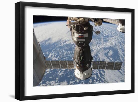 The Russian Soyuz Tma-11M Spacecraft Backdropped by Earth-null-Framed Photographic Print