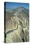 The serpentine new road to the summit of Jebel Hafit mountain near the al-'Ain oasis-Werner Forman-Stretched Canvas