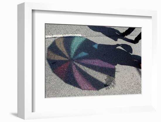 The Shadow of an Umbrella Is Cast on the Ground During the Annual Gay Pride Parade in Budapest-Laszlo Balogh-Framed Photographic Print