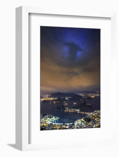 The Shadow of Christ the Redeemer Projected on to Clouds above Rio De Janeiro.-Jon Hicks-Framed Photographic Print