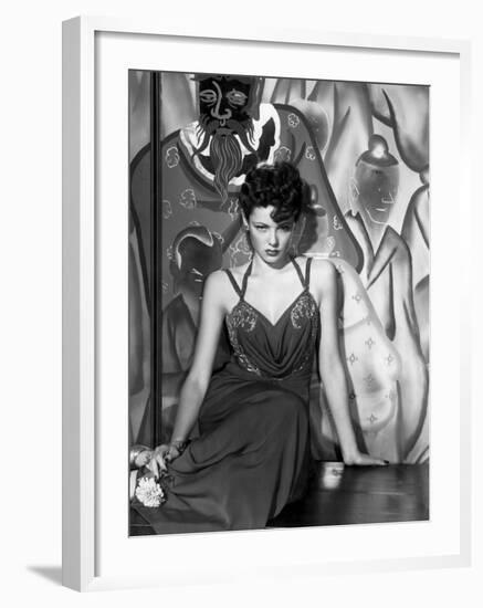 The Shanghai Gesture, Gene Tierney Wearing a Costume Designed by Oleg Cassini, 1941-null-Framed Photo