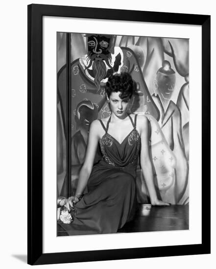 The Shanghai Gesture, Gene Tierney Wearing a Costume Designed by Oleg Cassini, 1941-null-Framed Photo