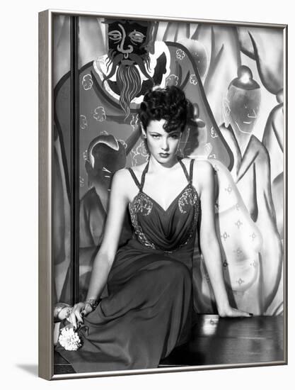 The Shanghai Gesture, Gene Tierney (Wearing a Costume Designed by Oleg Cassini), 1941-null-Framed Photo