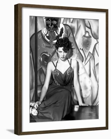 The Shanghai Gesture, Gene Tierney (Wearing a Costume Designed by Oleg Cassini), 1941-null-Framed Photo