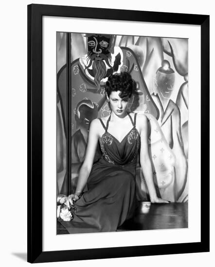 The Shanghai Gesture, Gene Tierney (Wearing a Costume Designed by Oleg Cassini), 1941-null-Framed Photo