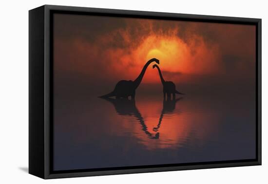 The Silhouetted Shapes of Sauropod Dinosaurs at the End of a Prehistoric Day-Stocktrek Images-Framed Stretched Canvas