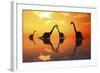 The Silhouetted Shapes of Sauropod Dinosaurs at the Start of a Prehistoric Day-Stocktrek Images-Framed Art Print