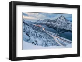 The snowy peaks above the frozen sea framed by the blue lights of dusk, Gryllefjorden, Senja, Troms-Roberto Moiola-Framed Photographic Print