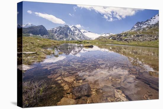 The Snowy Peaks are Reflected in the Clear Waters of Lake Piz, Switzerland-Roberto Moiola-Stretched Canvas