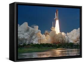 The Space Shuttle Discovery Rises from the Swamps Surrounding its Pad at Kennedy Space Center-null-Framed Stretched Canvas