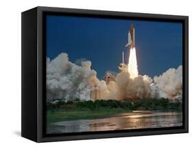 The Space Shuttle Discovery Rises from the Swamps Surrounding its Pad at Kennedy Space Center-null-Framed Stretched Canvas