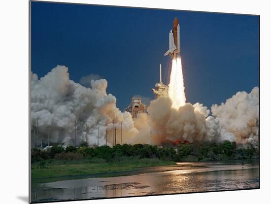 The Space Shuttle Discovery Rises from the Swamps Surrounding its Pad at Kennedy Space Center-null-Mounted Photographic Print