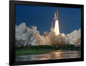 The Space Shuttle Discovery Rises from the Swamps Surrounding its Pad at Kennedy Space Center-null-Framed Photographic Print