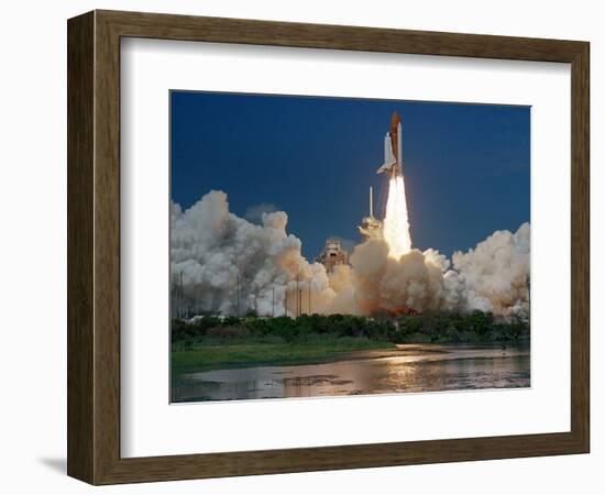 The Space Shuttle Discovery Rises from the Swamps Surrounding its Pad at Kennedy Space Center-null-Framed Photographic Print