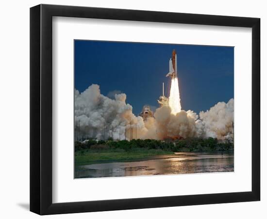 The Space Shuttle Discovery Rises from the Swamps Surrounding its Pad at Kennedy Space Center-null-Framed Photographic Print