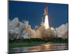 The Space Shuttle Discovery Rises from the Swamps Surrounding its Pad at Kennedy Space Center-null-Mounted Photographic Print