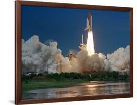 The Space Shuttle Discovery Rises from the Swamps Surrounding its Pad at Kennedy Space Center-null-Framed Photographic Print