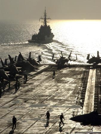 https://imgc.allpostersimages.com/img/posters/the-spanish-navy-frigate-alvaro-de-bazan-pulls-away-from-aircraft-carrier-uss-theodore-roosevelt_u-L-PJ10Z20.jpg?artPerspective=n