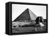 The Sphinx and the Pyramid of Cheops Standing in the Desert-null-Framed Stretched Canvas