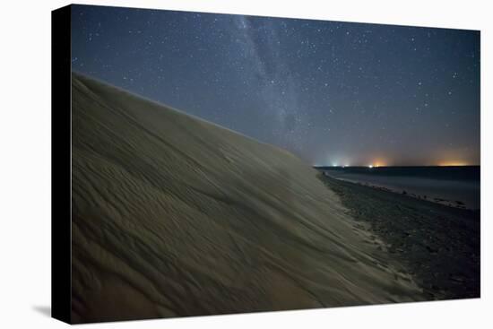 The Stars and Milky Way over the Dunes in Jericoacoara, Brazil-Alex Saberi-Stretched Canvas