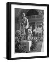 The Statue of Aphrodite and Eros in Louvre Museum During a Flower Show-Dmitri Kessel-Framed Photographic Print