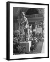 The Statue of Aphrodite and Eros in Louvre Museum During a Flower Show-Dmitri Kessel-Framed Photographic Print