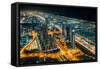 The street lights and skyscrapers of Dubai from high above the city, Dubai, United Arab Emirates-Logan Brown-Framed Stretched Canvas