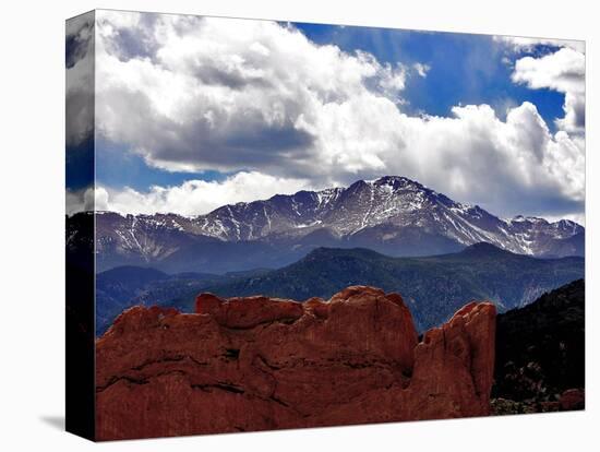 The Sun Breaks Through the Clouds to Highlight the Summit of Pikes Peak-null-Stretched Canvas