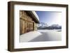 The Sun, Covered by Thin Clouds, Illuminating a Typical Hut Covered with Snow at the Maloja Pass-Roberto Moiola-Framed Photographic Print