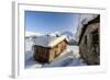 The Sun, Covered with Thin Clouds, Illuminating a Typical Hut Covered with Snow at the Maloja Pass-Roberto Moiola-Framed Photographic Print