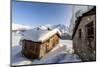 The Sun, Covered with Thin Clouds, Illuminating a Typical Hut Covered with Snow at the Maloja Pass-Roberto Moiola-Mounted Photographic Print