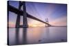 The sun rises on the Vasco da Gama Bridge that spans the Tagus River Lisbon Portugal Europe-ClickAlps-Stretched Canvas