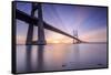 The sun rises on the Vasco da Gama Bridge that spans the Tagus River Lisbon Portugal Europe-ClickAlps-Framed Stretched Canvas