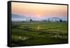 The Sun Sets Behind Foggy Hills and Expansive Rice Paddy Fields Near Chiang Mai, Thailand-Dan Holz-Framed Stretched Canvas