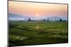 The Sun Sets Behind Foggy Hills and Expansive Rice Paddy Fields Near Chiang Mai, Thailand-Dan Holz-Mounted Photographic Print