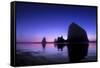 The Sun Sets Behind Haystack Rock at Cannon Beach, Oregon-Ben Coffman-Framed Stretched Canvas