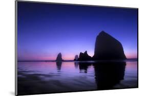 The Sun Sets Behind Haystack Rock at Cannon Beach, Oregon-Ben Coffman-Mounted Photographic Print