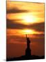 The Sun Sets Behind the Statue of Liberty on the Longest Day of the Year-null-Mounted Premium Photographic Print