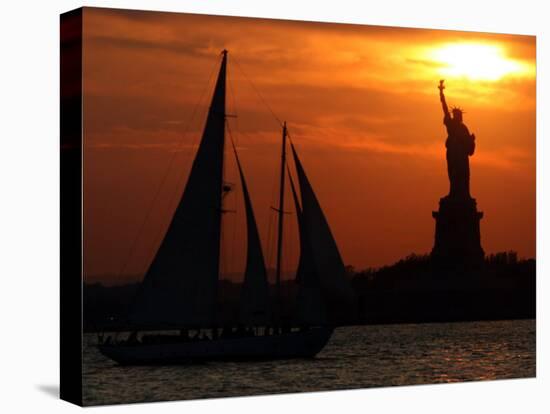 The Sun Sets Behind the Statue of Liberty on the Longest Day of the Year-null-Stretched Canvas