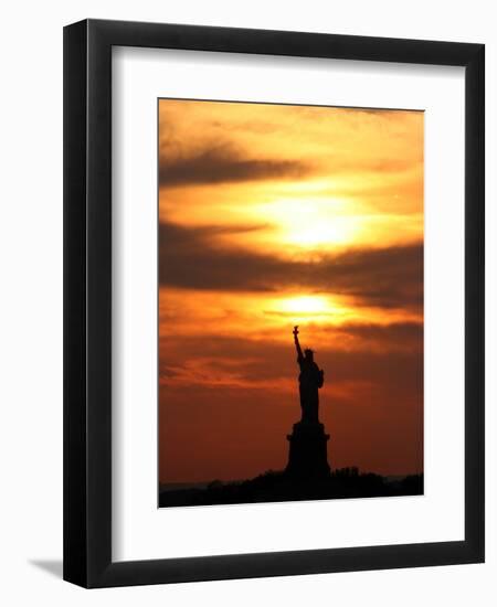 The Sun Sets Behind the Statue of Liberty on the Longest Day of the Year-null-Framed Premium Photographic Print