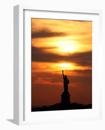 The Sun Sets Behind the Statue of Liberty on the Longest Day of the Year-null-Framed Photographic Print