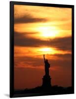 The Sun Sets Behind the Statue of Liberty on the Longest Day of the Year-null-Framed Photographic Print