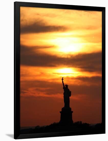 The Sun Sets Behind the Statue of Liberty on the Longest Day of the Year-null-Framed Photographic Print