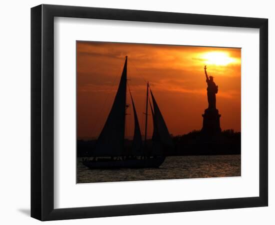 The Sun Sets Behind the Statue of Liberty on the Longest Day of the Year-null-Framed Photographic Print