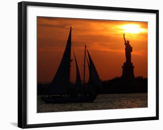 The Sun Sets Behind the Statue of Liberty on the Longest Day of the Year-null-Framed Photographic Print