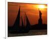 The Sun Sets Behind the Statue of Liberty on the Longest Day of the Year-null-Framed Photographic Print