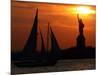 The Sun Sets Behind the Statue of Liberty on the Longest Day of the Year-null-Mounted Photographic Print